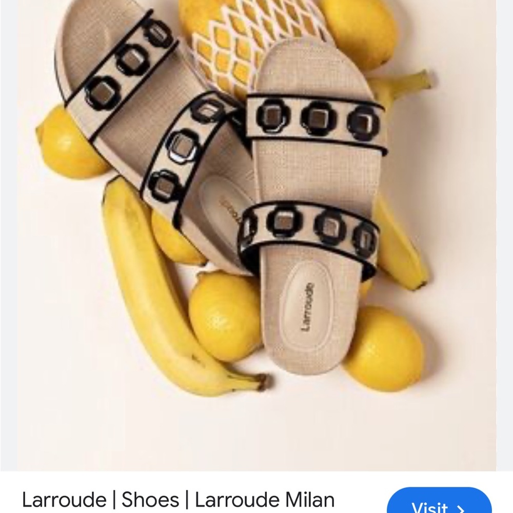 Larroude Beige Slide Sandals with Black Trim and Buckle Accents